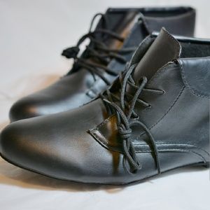 Black faux leather flat booties